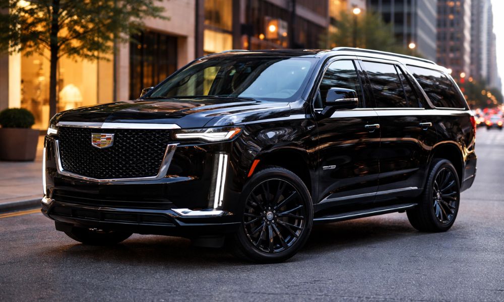 Black Cadillac Escalade luxury SUV parked on city street