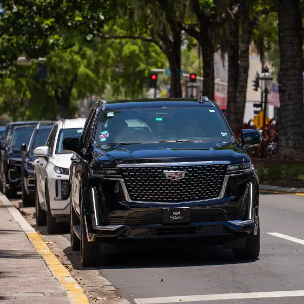 Black Cadillac Escalade luxury SUV providing premium car service from Miami to Fort Myers
