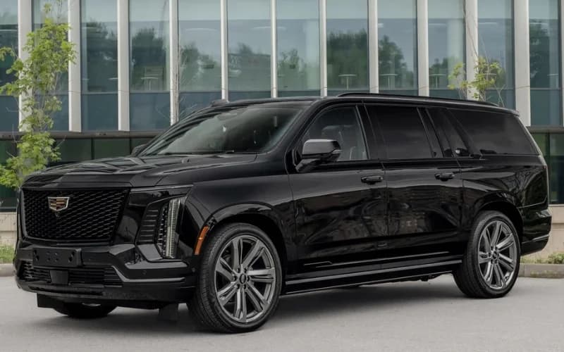 Black Chevrolet Suburban Premium SUV, seating for 6 passengers and 6 bags