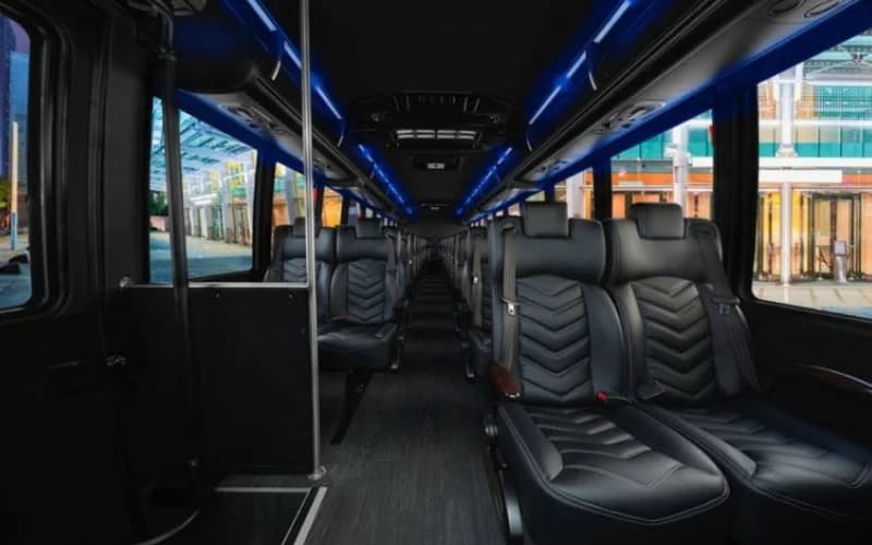 Corporate Coach Bus interior with luxury leather seating for professional team events