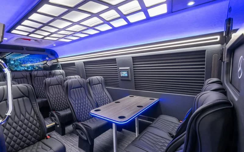 Mercedes Executive Sprinter Limo interior with diamond-stitched seating and party lighting