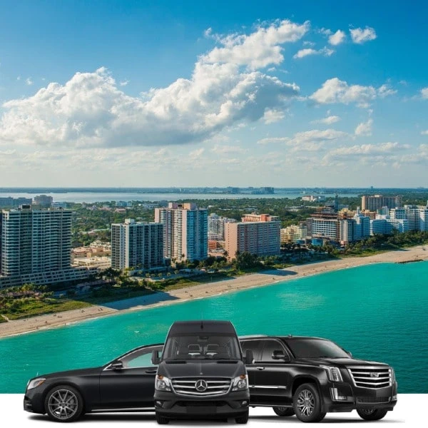 black luxury vehicles with coastal city beach background